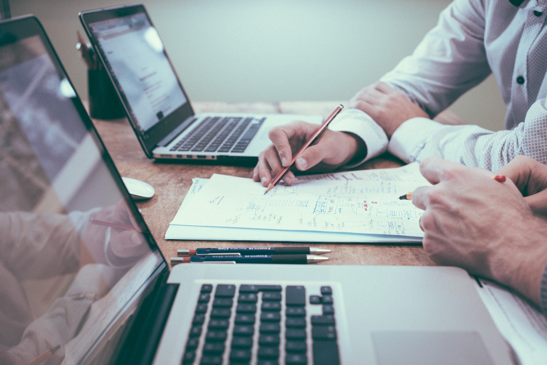 Business professionals analyzing residential building assets spreadsheet matrices